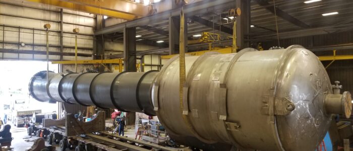 Lifting large evaporator with overhead cranes